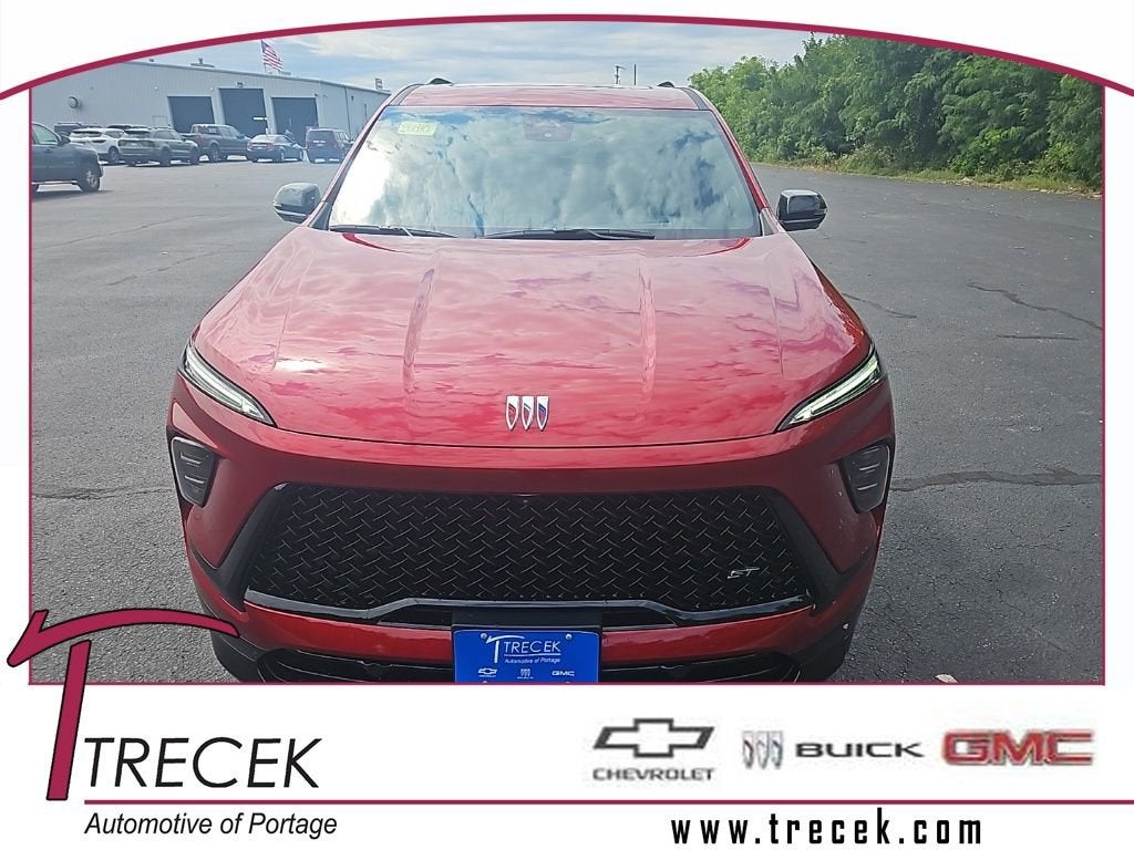 2026 Buick Enclave Sport Touring in Cherry Red Tintcoat — front three-quarter view